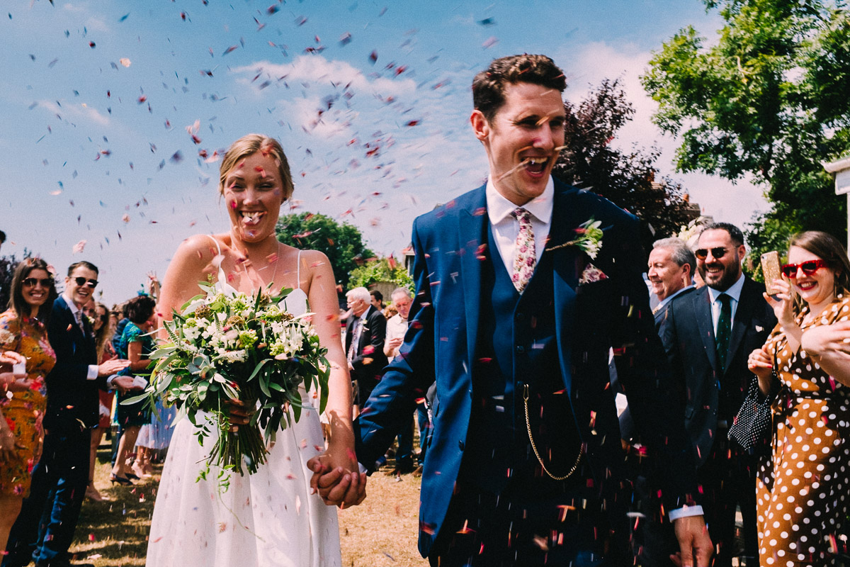 COLOURFUL CONFETTI SHOT GLYNDWR VINEYARD WEDDING COWBRIDGE COLOURFUL CONFETTI SHOT GLYNDWR VINEYARD WEDDING COWBRIDGE